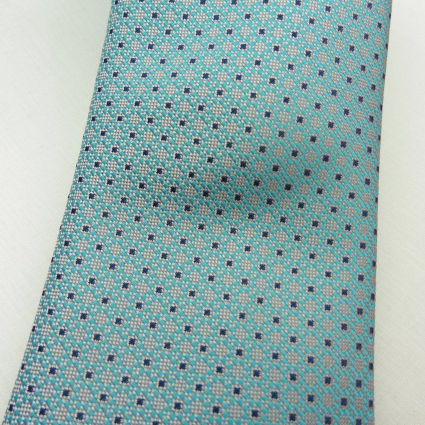 Corbata  mini puntos turquesa con gris perla de Boccola