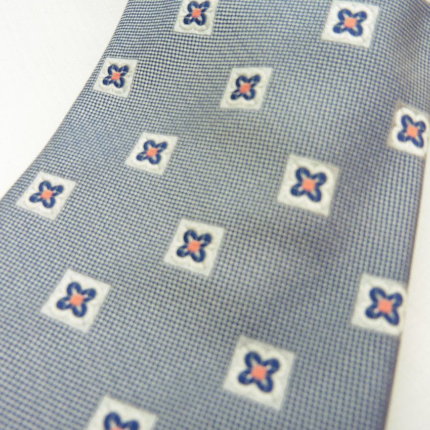 Corbata azul con flores azules y naranja de Boccola