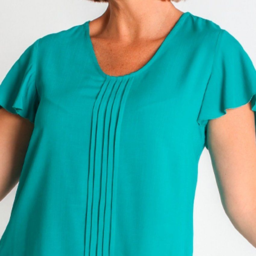 Blusa verde esmeralda de Lourdes Castillo