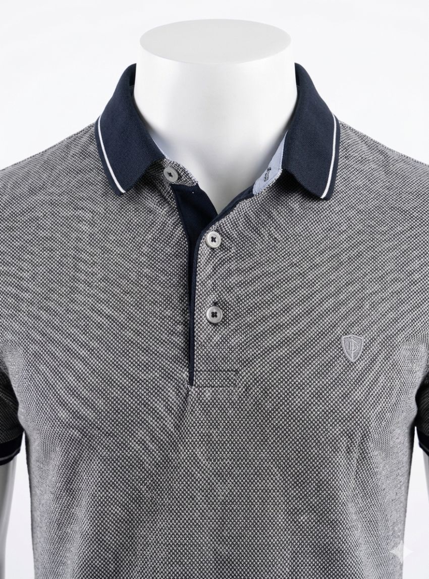 Polo puntos azul marino y blancos de Tomé